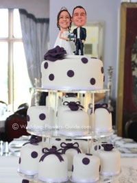 personalized prple and white wedding cake with cake topper