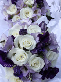 close up of purple, lilac and white wedding bouquets